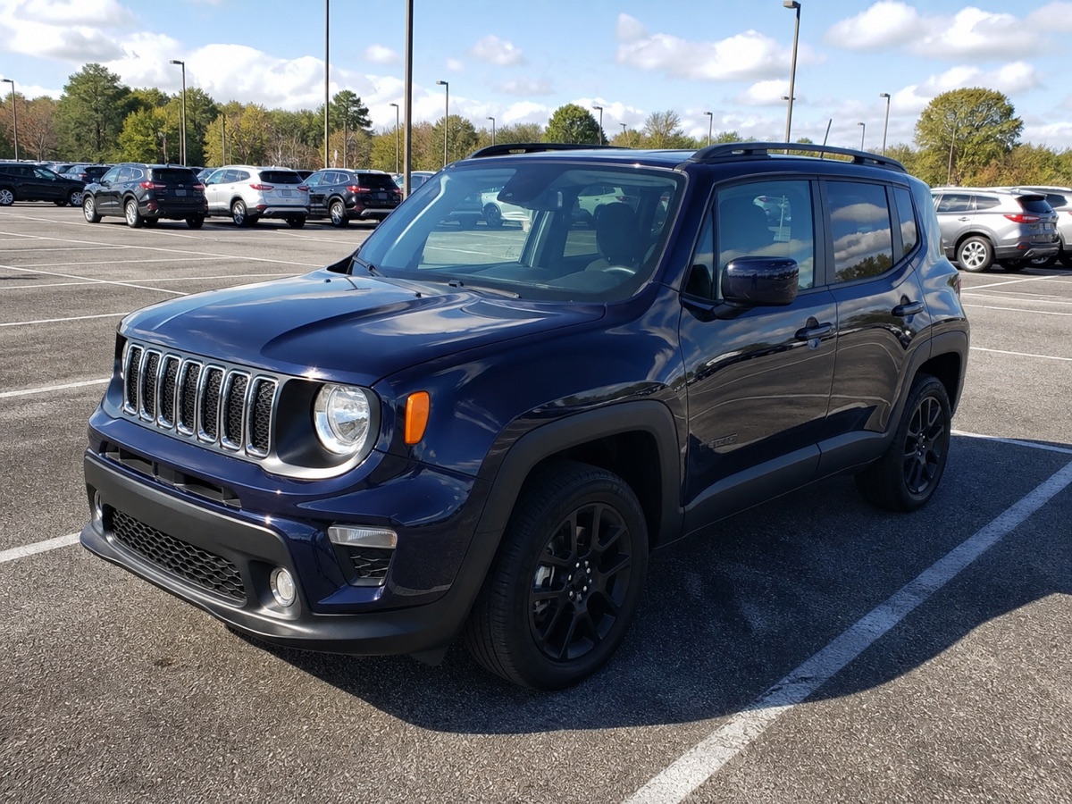 Dark blue SUV photographed in an outdoor parking lot